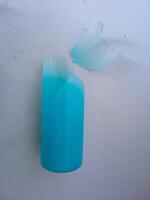 a glass bottle that broke when it fell photo