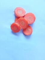 Carrot slices ready to be cooked isolate on white photo