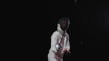 Skilled Fencer In Fencing Mask Defending And Attacking Rival, Epic Portrait In Slow Motion video