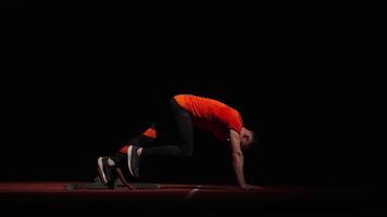 Runner Standing On Starting Blocks For Start, Side View Of Sportsman Preparing To Sprint Race video