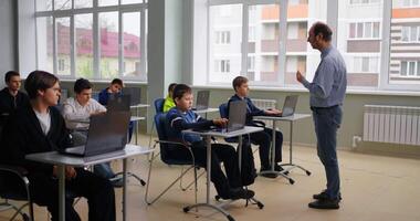Teacher Speaking In Computer-Based Class, Diverse School Boys Learning In Coding Class, Smart Kids video