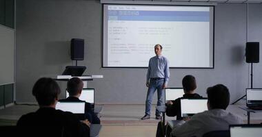 Male Teacher Of Programming And Computer Science Speaking In Classroom With School Students Boys video