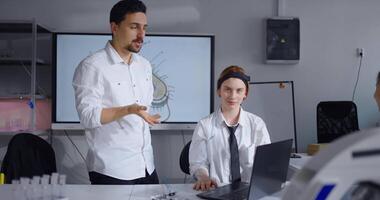 Teacher Explaining Rhythms Of Brain Activity, Demonstrating Work Of Electroencephalography In Class video