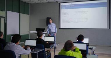 Adult Man Teaching Schoolers To Programming And Coding, Teens Boys Listening To Him, Optional Class video
