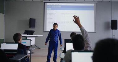 Smart Schoolboy Speaking In Front Classmates In Classroom, Presenting Program Code In Class video