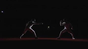 Professional Fencers With Epees Fighting On Fencing Track, View From Side In Darkness, Fencing Sport video