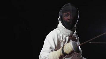 Portrait Of Male Fencer With Foil In Motion, Attack And Counter-Attack, Slow Motion Shot In Darkness video
