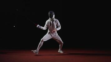 Fencer In Modern Uniform And Protective Helmet Training Alone On Fencing Track, Fighting With Air video