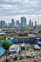 View of Mumbai skyline over slums in Bandra suburb photo