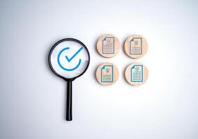 Document icon which print screen on wooden circle plank for prepare check and approve document, Quality assurance and ISO guarantee concept, Document management digital file data online. photo