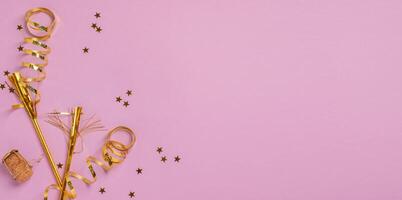 Festive background with golden serpentine, confetti and sparkles. Festive layout frame photo