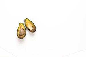 Spoiled rotten fruit vegetables avocado white background. Top view copy space photo