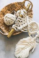 Handmade knitting macrame. Boho lifestyle. Hobby hobby concept. Selective focus vertical frame photo