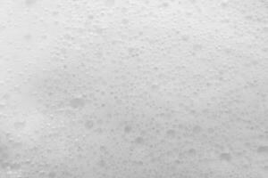 Abstract white soap foam bubbles texture background photo