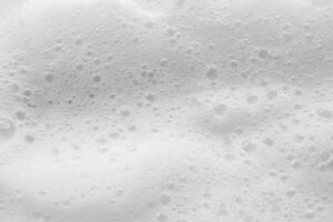 Abstract white soap foam bubbles texture background photo