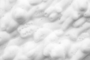 Abstract white soap foam bubbles texture background photo