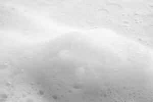 Abstract white soap foam bubbles texture background photo
