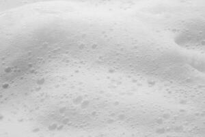 Abstract white soap foam bubbles texture background photo