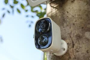 Security IP CCTV camera using solar energy install on the tree for home security system photo