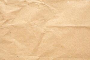 Abstract crumpled and creased recycle brown paper texture background photo