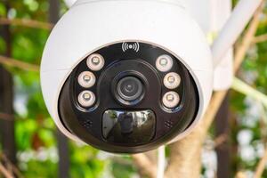 Security IP CCTV camera using solar energy install on the tree for home security system photo