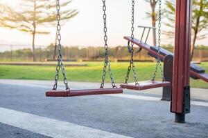 Empty chain swing in the playground photo
