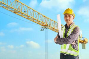 construction engineer worker in protective helmet and blueprints paper on hand at building site background photo