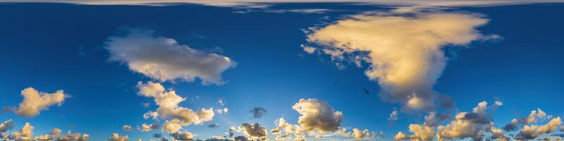 Dark blue sunset sky panorama with Cumulus clouds. Seamless hdr pano in spherical equirectangular format. Complete zenith for 3D visualization, game and sky replacement for aerial drone 360 panoramas. photo