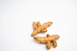 Turmeric is a typical Indonesian spice that is yellow in color. in Groups. typical Indonesian. isolated on white background. photo