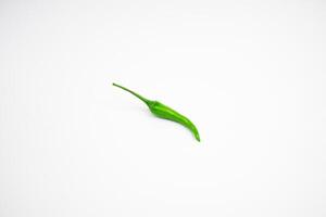 Single green cayenne pepper. isolated on white background. photo