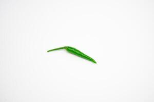 Single green cayenne pepper. isolated on white background. photo