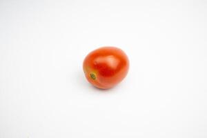 single fresh red tomato. isolated on white background. photo