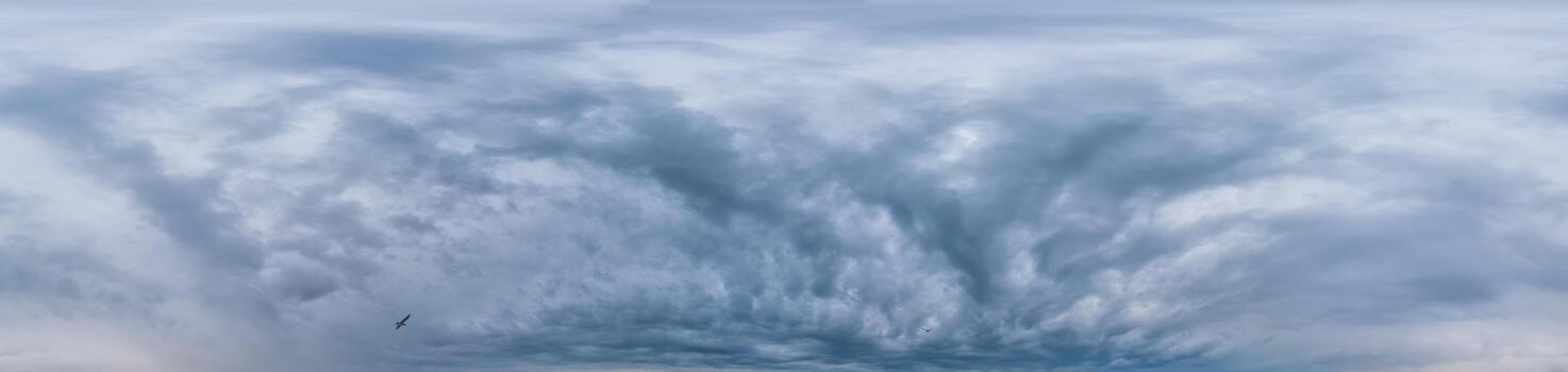 Sky panorama on overcast rainy day with low clouds in seamless spherical equirectangular format. Complete zenith for use in 3D graphics, game and for aerial drone 360 degree panorama as a sky dome photo