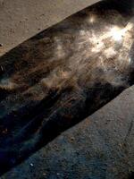 Abstract background of long shadows and sunlight on the ground. The sunlight is still yellowish in the morning and the shadows of objects can be seen faintly forming a unique texture photo