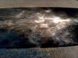 Abstract background of long shadows and sunlight on the ground. The sunlight is still yellowish in the morning and the shadows of objects can be seen faintly forming a unique texture photo