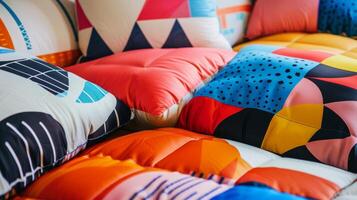 The bed is covered with inflatable throw pillows featuring bold geometric patterns in vibrant colors photo