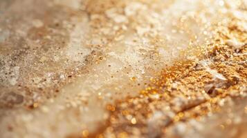 In this image the soft beige tones of a natural stone countertop are brought to life by intricate flecks of rich gold and copper giving the surface a warm and luxurious feel photo