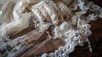 A beautiful arrangement of lace gloves on a vintage table runner accented with delicate lace doilies and small pearls exuding a sense of luxury and refinement photo