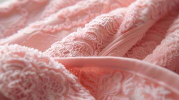 Add a pop of color to your selfcare routine with this blush pink bathrobe featuring a plush fabric and delicate lace sleeves photo