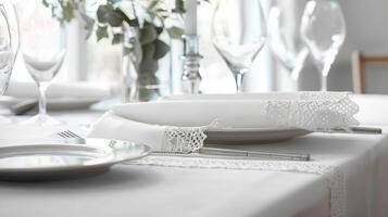 A simple yet elegant tablescape featuring crisp white tablecloths with a subtle lace border brings a touch of understated beauty to any occasion photo