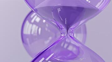 A purple inflatable 3D hourglass with a sandlike texture and curved edges representing the passing of time and the importance of making the most of it photo