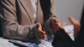 Two executive discussing company growth project success financial statistics, Partner meeting professional investor working start up project for both company with document, laptop and digital tablet. video