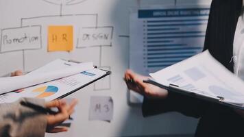 Two executive discussing company growth project success financial statistics, Partner meeting professional investor working start up project for both company with document, laptop and digital tablet. video