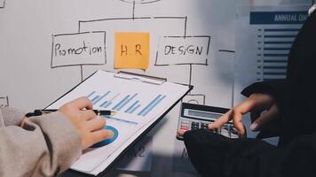 Two executive discussing company growth project success financial statistics, Partner meeting professional investor working start up project for both company with document, laptop and digital tablet. video