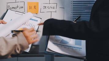 Two executive discussing company growth project success financial statistics, Partner meeting professional investor working start up project for both company with document, laptop and digital tablet. video