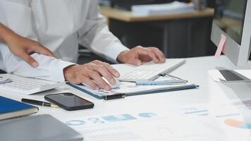 Diverse managers traders analysts discussing financial growth market at desk with laptop with graphs on screen using tablet device. Investors brokers analysing indexes online cryptocurrency stock. video