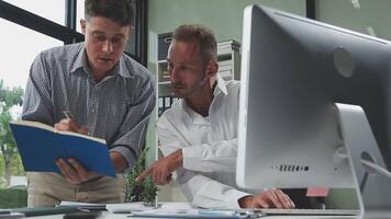 Diverse managers traders analysts discussing financial growth market at desk with laptop with graphs on screen using tablet device. Investors brokers analysing indexes online cryptocurrency stock. video