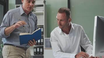 Diverse managers traders analysts discussing financial growth market at desk with laptop with graphs on screen using tablet device. Investors brokers analysing indexes online cryptocurrency stock. video