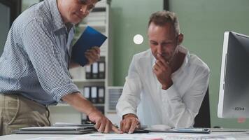 Diverse managers traders analysts discussing financial growth market at desk with laptop with graphs on screen using tablet device. Investors brokers analysing indexes online cryptocurrency stock. video