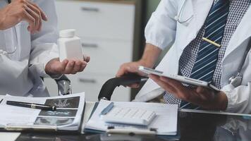 Doctors in office working on medical report video